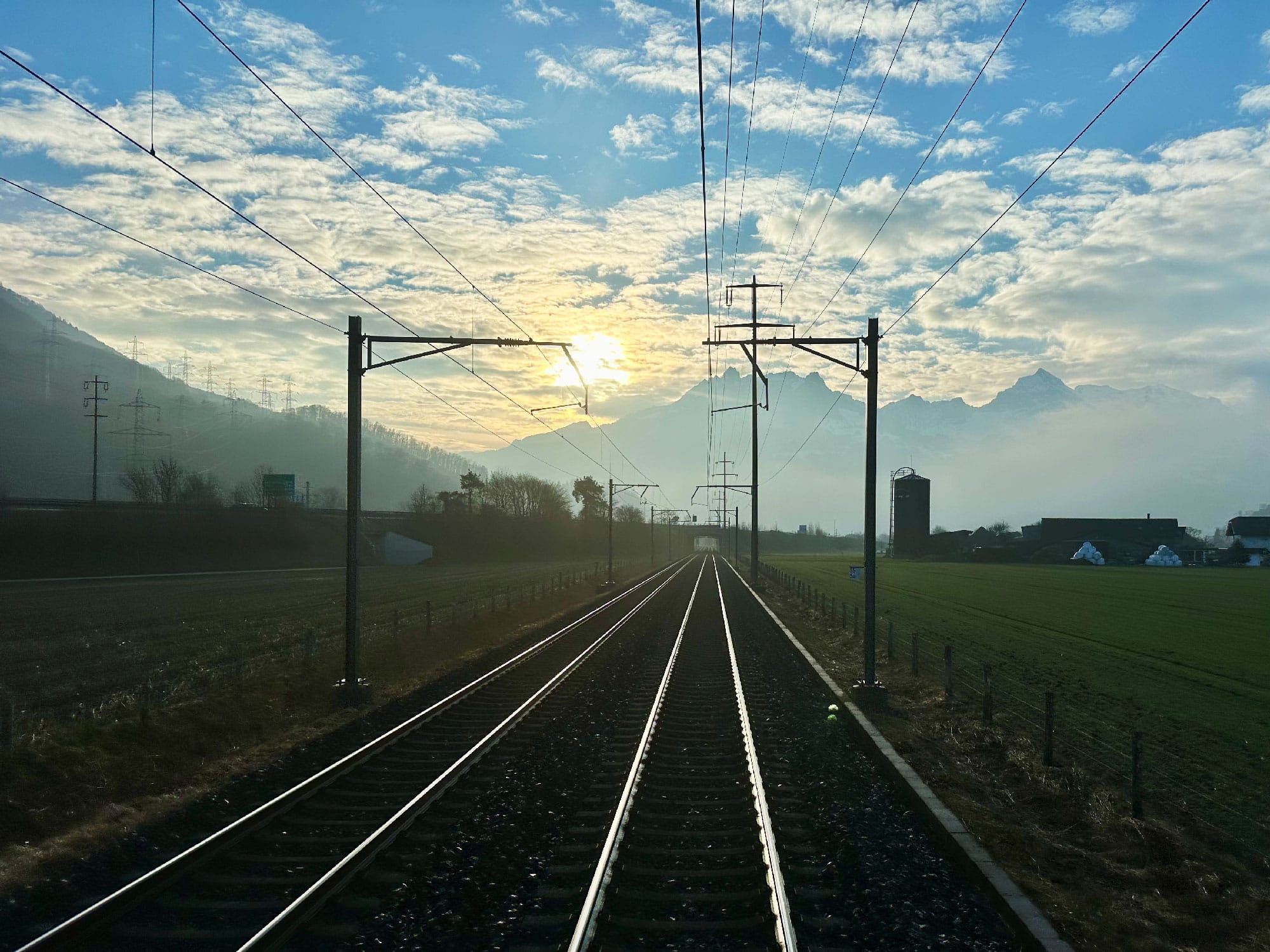 Sunrise aboard the EuroNight just before Ziegelbrücke in Switzerland.