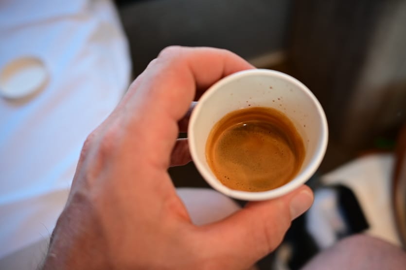 An espresso with light brown foam